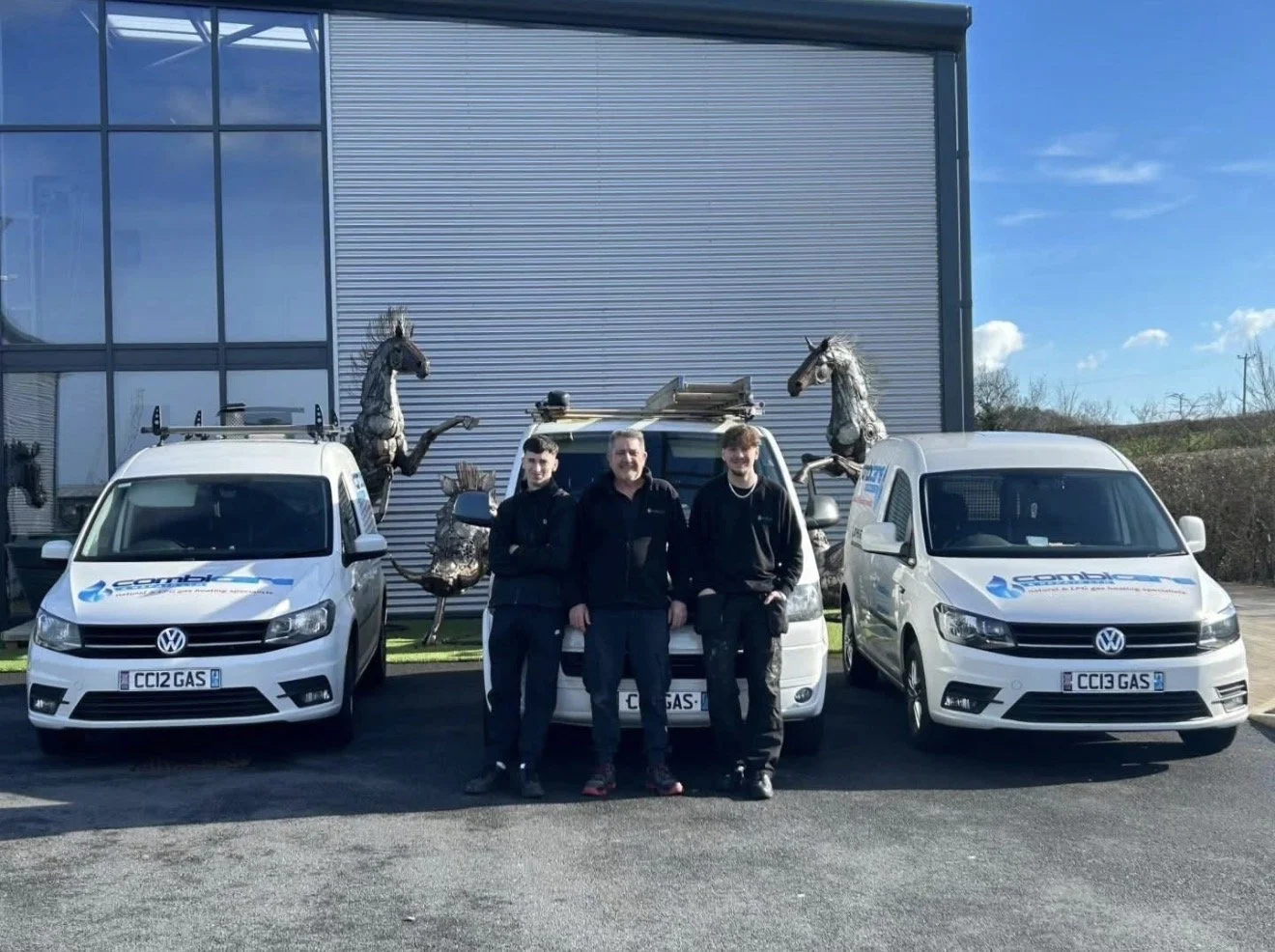 The Combi Care & Repair team standing in front of their vans
